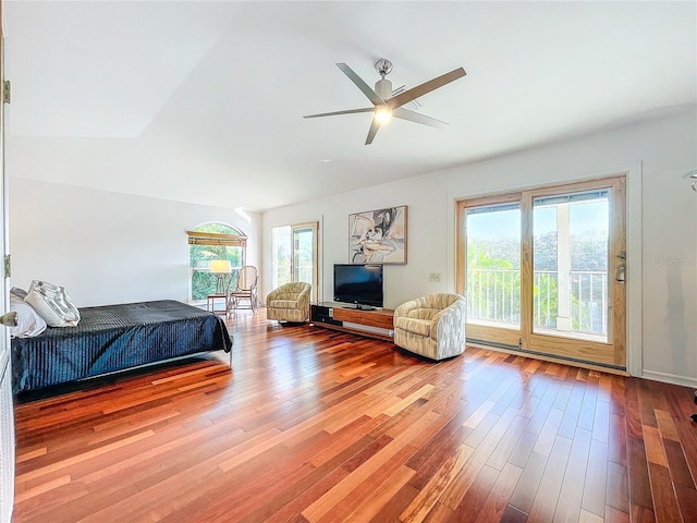 bedroom featuring wood-type flooring and access to exterior