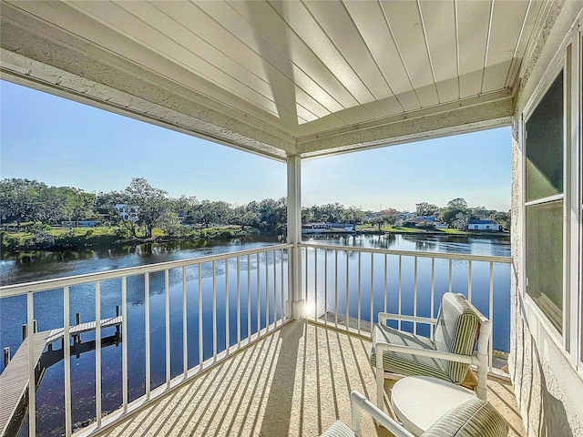 balcony featuring a water view