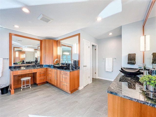 kitchen featuring kitchen peninsula and sink