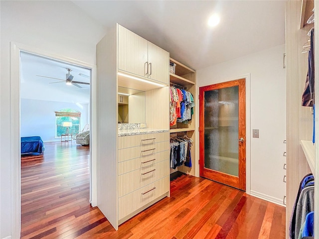 spacious closet with wood-type flooring and ceiling fan