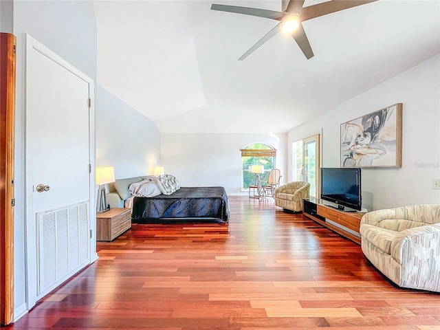 bedroom featuring lofted ceiling, hardwood / wood-style flooring, and ceiling fan