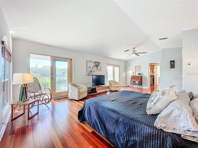 bedroom with lofted ceiling, access to exterior, hardwood / wood-style flooring, and ceiling fan