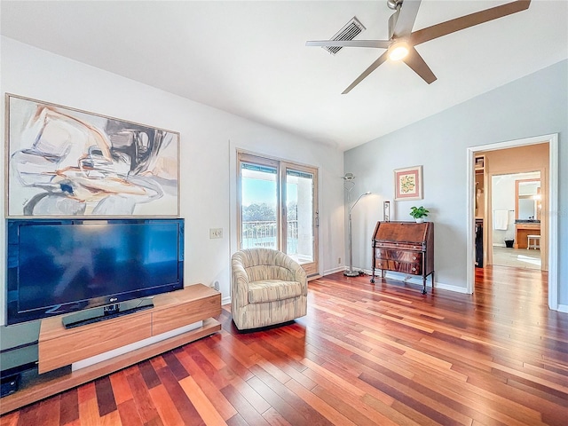 sitting room with wood-type flooring, lofted ceiling, and ceiling fan