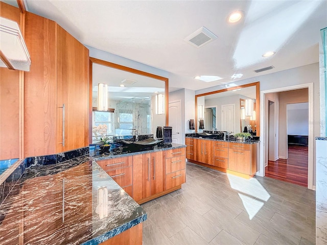 kitchen featuring dark stone countertops