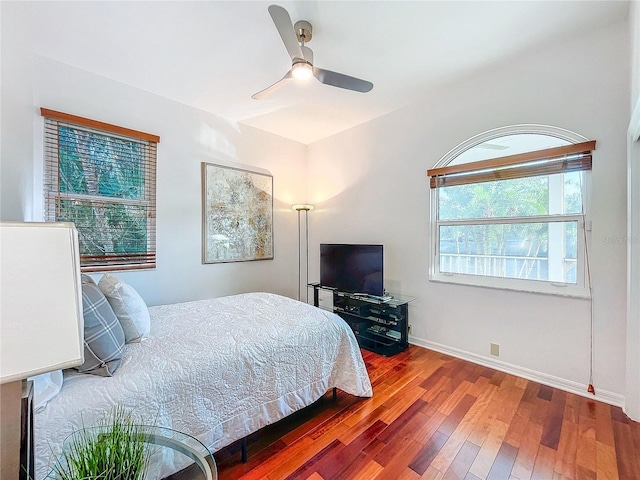 bedroom with ceiling fan and hardwood / wood-style floors