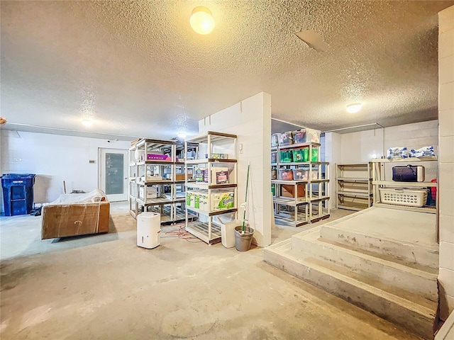 basement with a textured ceiling