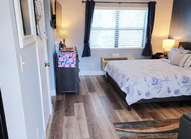 bedroom featuring dark hardwood / wood-style flooring