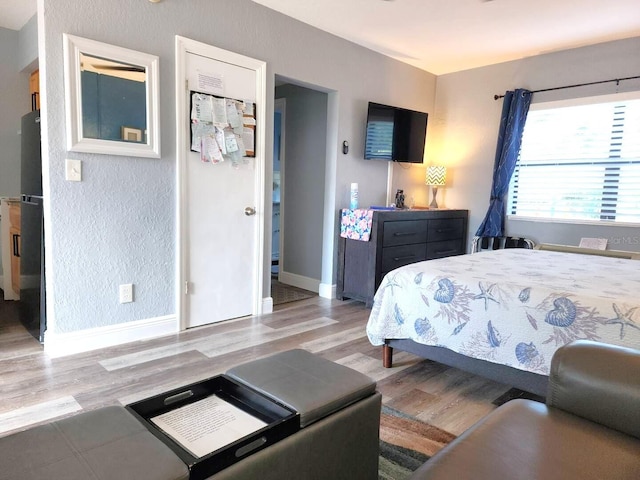 bedroom with light wood-type flooring