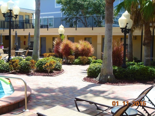 surrounding community featuring a patio area