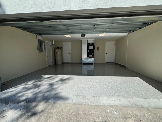 garage with a garage door opener, electric panel, and water heater