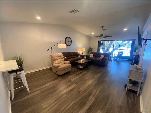 living room featuring vaulted ceiling, dark hardwood / wood-style floors, and ceiling fan