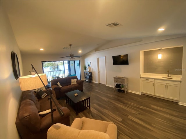 living room featuring sink, vaulted ceiling, dark hardwood / wood-style floors, and ceiling fan