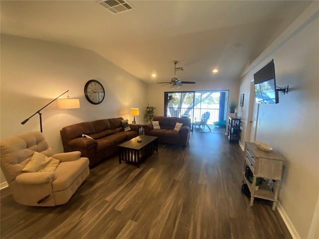 living room with lofted ceiling and dark hardwood / wood-style flooring