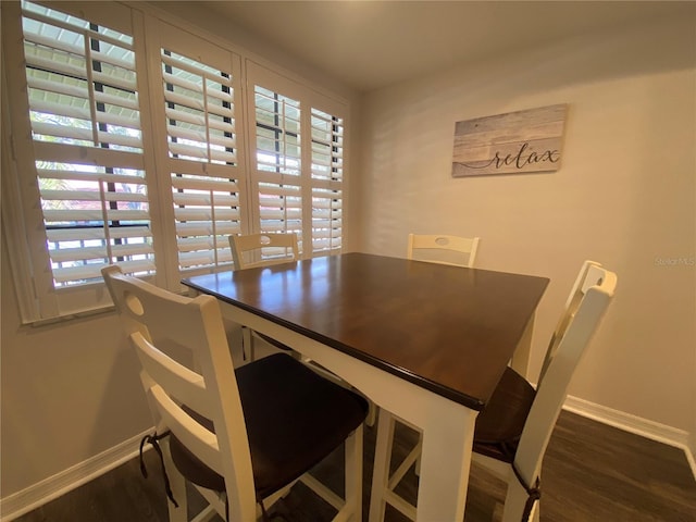 dining room featuring dark hardwood / wood-style flooring