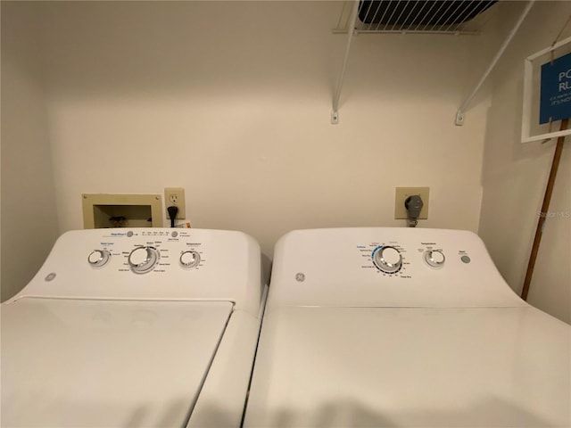 washroom featuring washing machine and dryer