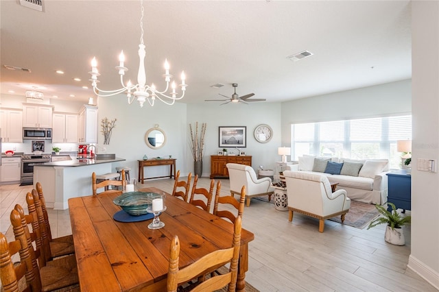 dining area featuring ceiling fan and light wood-type flooring