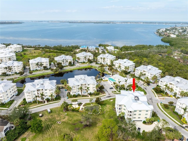 birds eye view of property featuring a water view