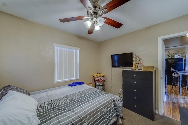 carpeted bedroom with ceiling fan