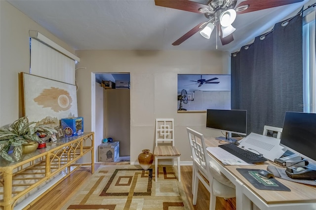 office with ceiling fan and hardwood / wood-style floors