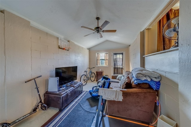 living room with lofted ceiling, a stone fireplace, and ceiling fan