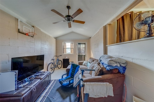 living room with ceiling fan and vaulted ceiling