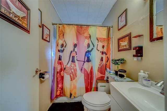 full bathroom with vanity, shower / bath combo with shower curtain, and toilet