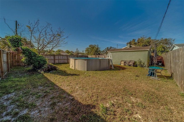 view of yard featuring a fenced in pool