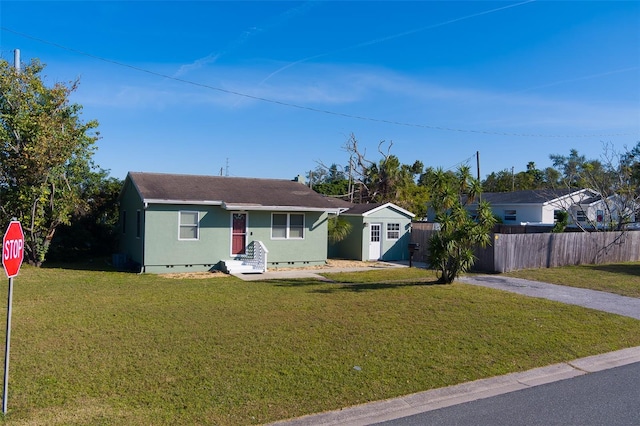 ranch-style house with a front yard