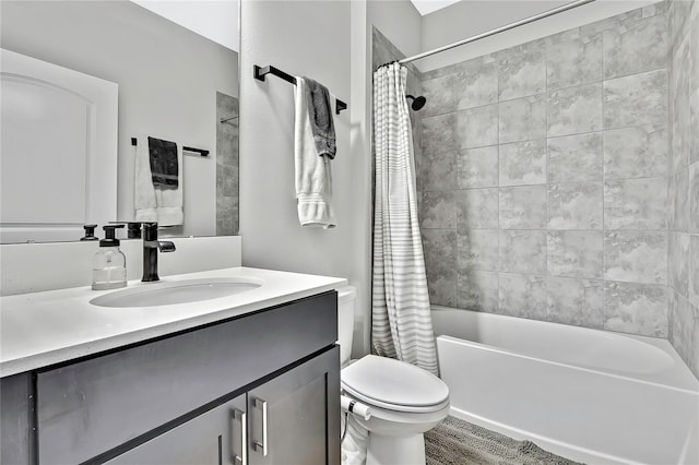 full bathroom with vanity, shower / tub combo, and toilet