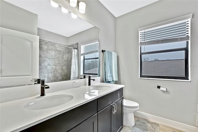 bathroom featuring vanity, toilet, a shower with shower curtain, and wood-type flooring