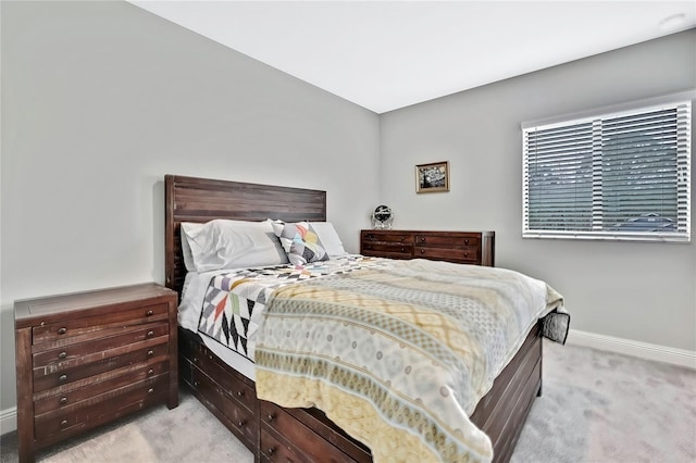 bedroom with light colored carpet