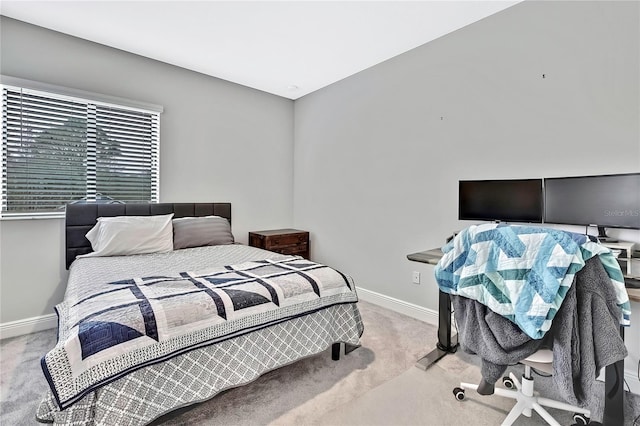 bedroom featuring light colored carpet