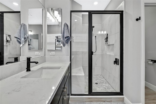 bathroom with vanity and an enclosed shower