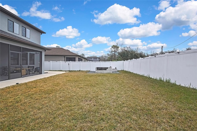 view of yard featuring a patio area and a sunroom