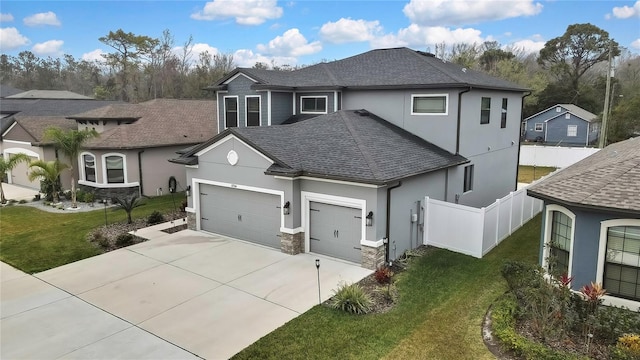 view of front of home with a garage and a front yard