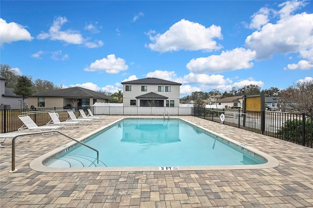 view of swimming pool featuring a patio area