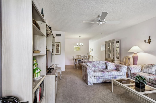 living room with ceiling fan with notable chandelier, light colored carpet, and a textured ceiling