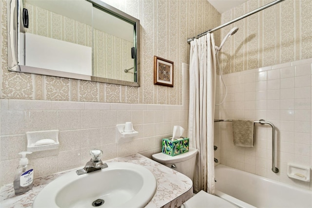 full bathroom featuring shower / tub combo, vanity, tile walls, and toilet