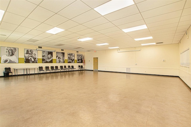 interior space featuring a drop ceiling