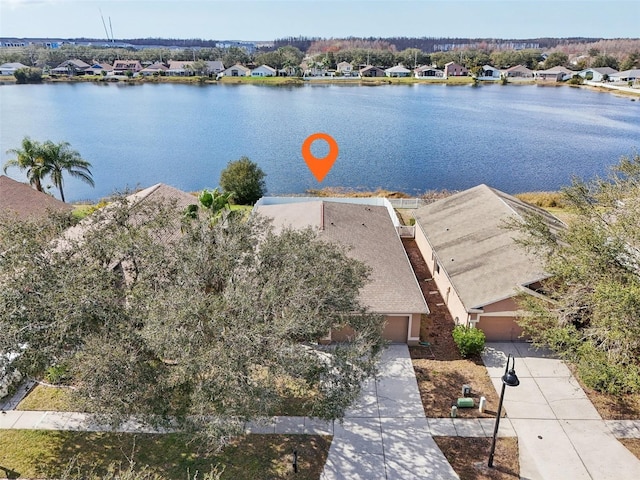 bird's eye view with a water view and a residential view