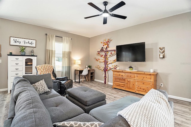 living room with hardwood / wood-style flooring and ceiling fan