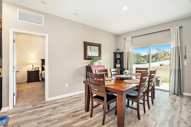 dining space featuring light hardwood / wood-style floors