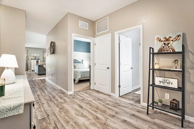 hallway featuring light wood-type flooring