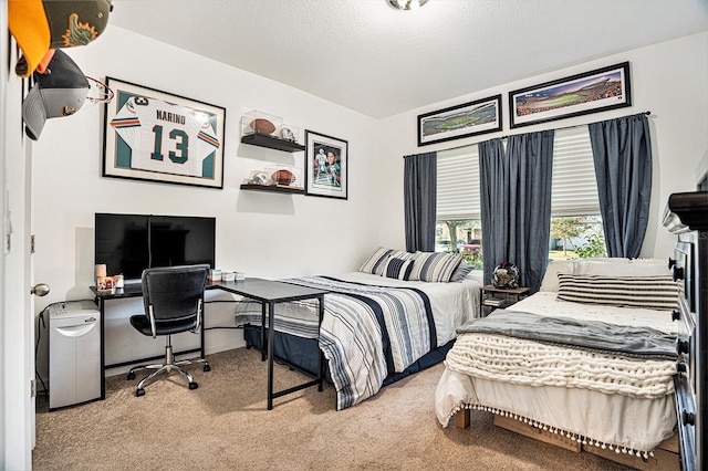 carpeted bedroom featuring a textured ceiling