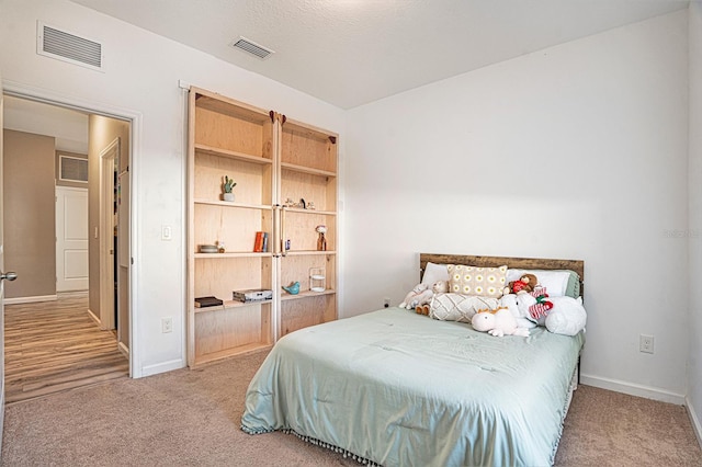 bedroom with light colored carpet