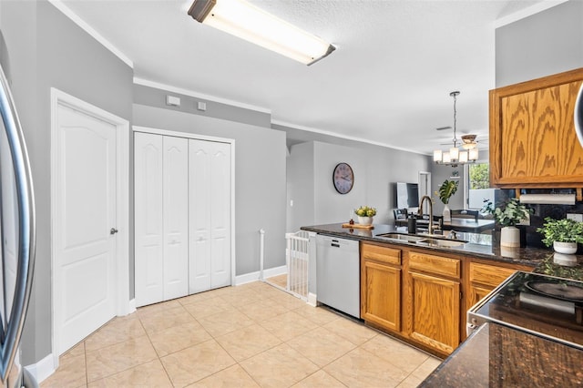 kitchen featuring sink, crown molding, light tile patterned floors, hanging light fixtures, and stainless steel appliances