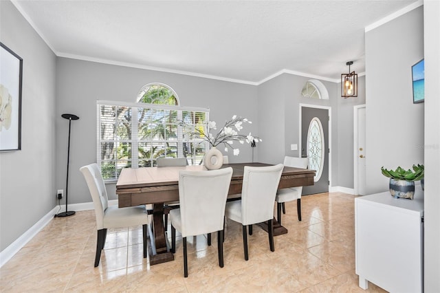 dining area featuring ornamental molding and a textured ceiling