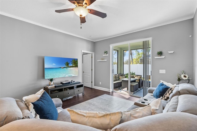 living room featuring dark wood-type flooring and ceiling fan