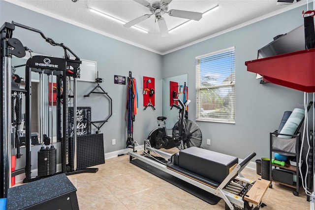 workout room featuring crown molding, ceiling fan, and a textured ceiling