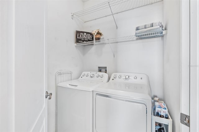 laundry area with independent washer and dryer